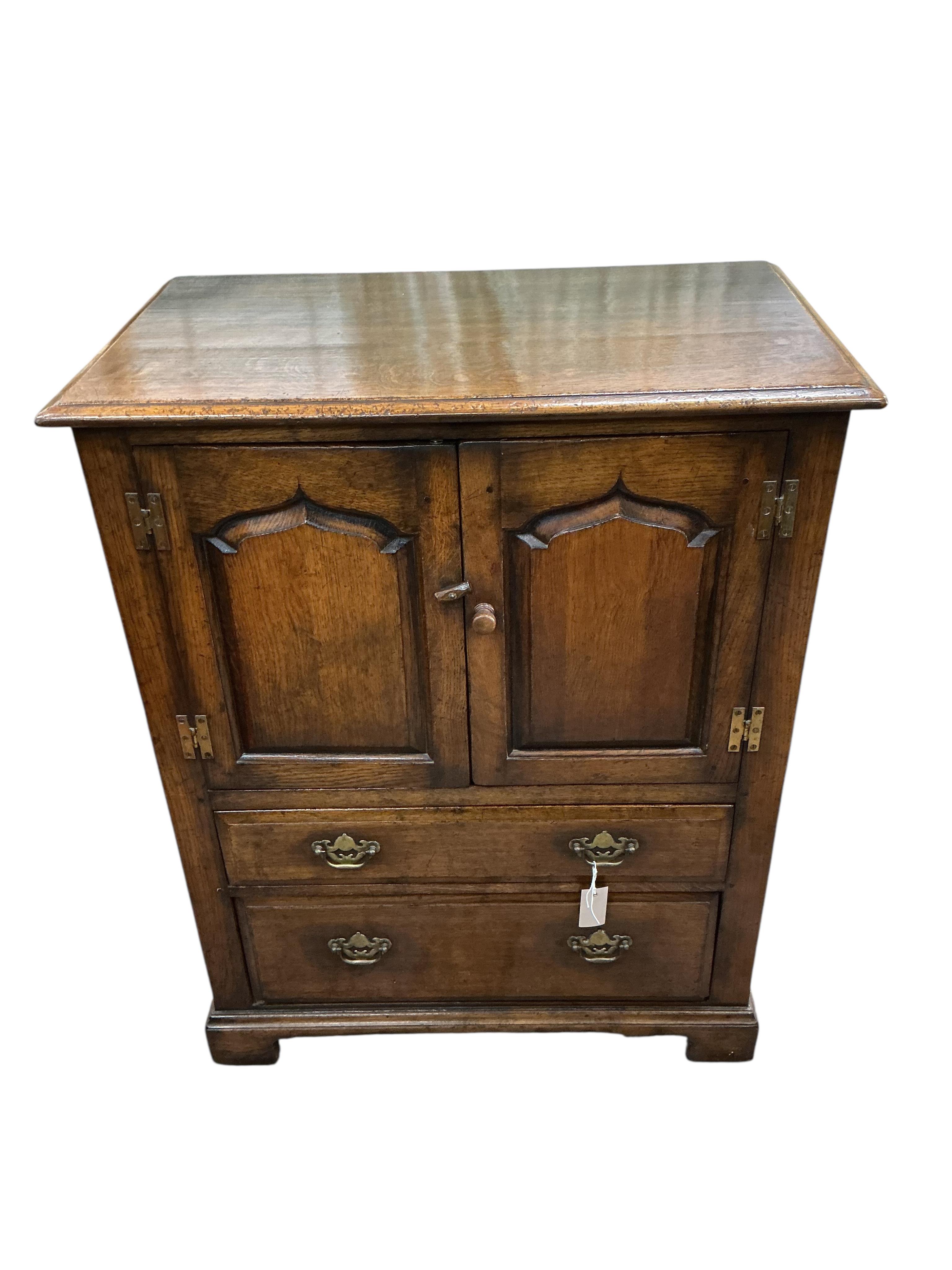 A reproduction 18th century style oak two drawer side cabinet, width 81cm, depth 48cm, height 103cm